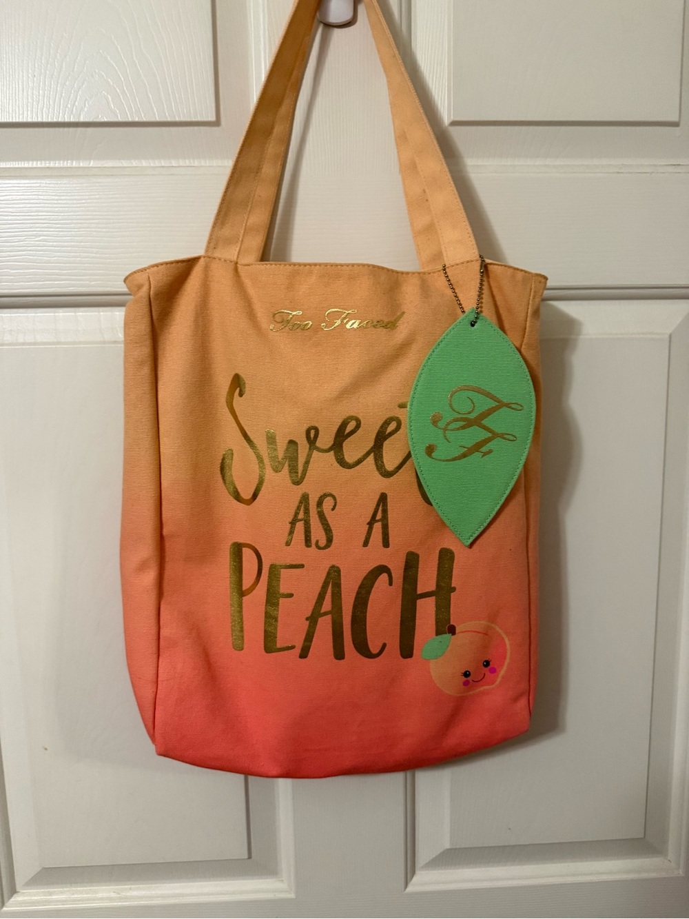 Too Faced Peach Ombre Tote with Green Leaf Tag